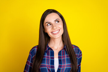 Poster - Photo portrait of pretty young girl look empty space wear trendy plaid outfit isolated on yellow color background