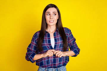 Sticker - Photo portrait of attractive young woman look shy nervous empty space dressed stylish plaid clothes isolated on yellow color background