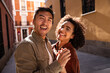 © ADDICTIVE STOCK - Happy multiethnic couple enjoying a sunny day in Madrid's charming streets