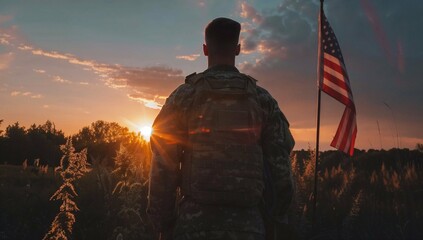 A soldier in uniform stands in a field with the American flag at sunset, symbolizing service and dedication