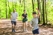 © Louis-Paul Photo - A Family exercising and jogging together at an outdoor park having great fun