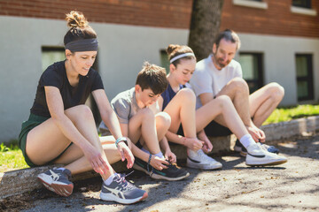 Wall Mural - A Family exercising and jogging together at an outdoor park having great fun