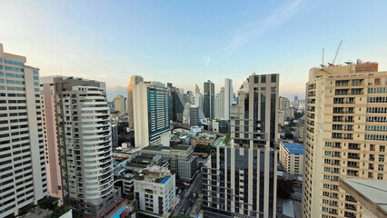 Poster - sunset hours in bangkok with skyscrapers