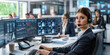 © forenna - female call center agent in professional attire, equipped with a headset, works at her desk surrounded by several monitors filled with data. Behind her, a team of colleagues engage