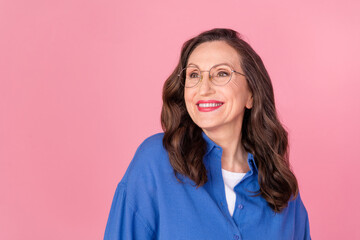 Sticker - Photo portrait of lovely senior lady look empty space dressed stylish blue garment isolated on pink color background