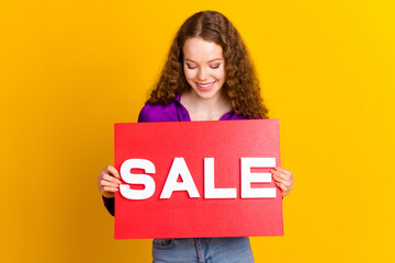 Wall Mural - Photo portrait of lovely young lady look hold sale plate dressed stylish violet garment isolated on yellow color background