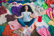 © deagreez - Above view full length photo of nice young girl lying meditate messy clutter clothes flat indoors