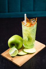 Canvas Print - Cold summer lemonade with apple, Apple drink with ice cubes. Summer cocktail with green apple and ice