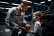 © VaCity - Father and Son Bonding in Car Workshop