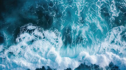 Wall Mural - Overhead photo of crashing waves on the shoreline. Tropical beach surf. Abstract aerial ocean view.