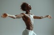 © Vladimir - Young male ballet dancer in a white leotard performs with grace and elegance on stage