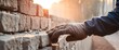 © anetlanda - Industrial bricklayer installing bricks on construction site