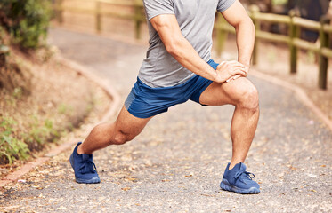 Canvas Print - Man, stretching leg and ready for exercise in outdoor, fitness and preparation for running. Male person, athlete and warm up for workout in park or nature, flexible and muscle relief for training