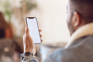 Poster - Man, back and smartphone screen in cafe, mock up and message notification or relax with tech mobile app. Browse, email and social media or online shopping, male person and blank communication