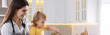 © New Africa - Mother and her little daughter cooking together in kitchen, space for text. Banner design