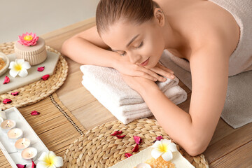 Wall Mural - Beautiful young woman relaxing in spa salon, closeup