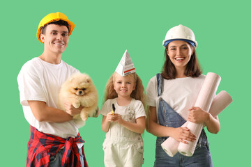 Sticker - Happy family with repair materials on green background