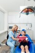 © Astock - child Dental treatment, Teeth healthcare, Professional stomatology kid, dental clinic, highlighting good dental care, child patient