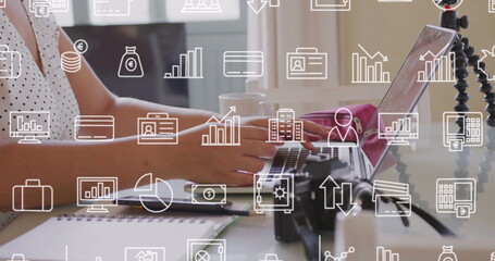 Poster - Image of multiple icons over midsection of caucasian woman using laptop