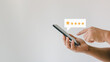 © THAWEERAT - Customer review satisfaction feedback survey concept. User give rating to service experience on online application. Customer can evaluate quality of service leading to reputation ranking of business.