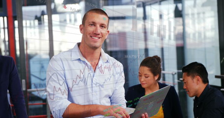 Poster - Image of statistical and stock market data processing over caucasian man using laptop at office