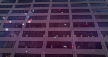 Poster - Image of red blue and white spots over building