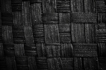 Wall Mural - Dark monochrome background from a textile material with wicker close-up texture - generative ai