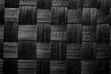 Wall Mural - Dark monochrome background from a textile material with wicker close-up texture - generative ai