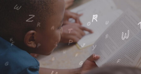 Poster - Image of letters over african american schoolboy reading