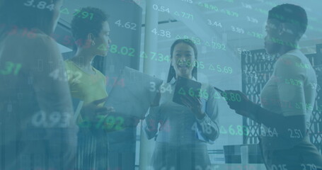 Poster - Image of trading board, diverse female coworkers discussing holding laptop and digital tablet