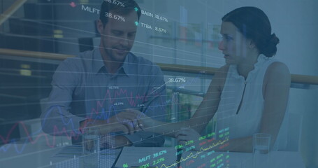 Poster - Image of data processing against diverse businessman and businesswoman discussing over documents