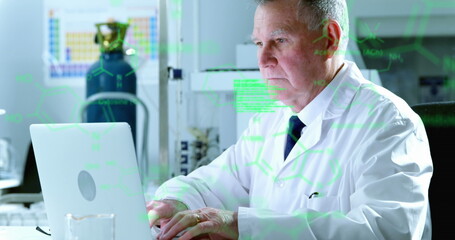 Canvas Print - Image of medical data processing over caucasian senior male scientist using laptop at laboratory