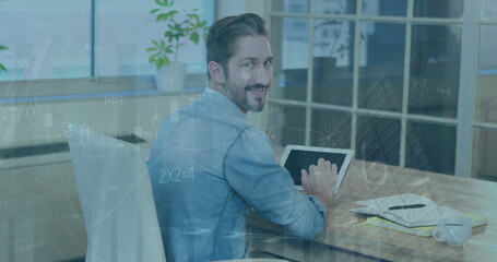 Poster - Image of infographic interface over caucasian smiling businessman using tablet at desk in office