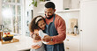 © peopleimages.com - Kitchen, father and girl with smile, hug and card for fathers day, love and care in family house. Home, dad and daughter with embrace, happiness and cute present in apartment, man or child with gift