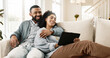 © peopleimages.com - Couple, love and internet on sofa with tablet on streaming application for home entertainment, subscription and movies. Man, woman and together in house with technology on couch for online videos.