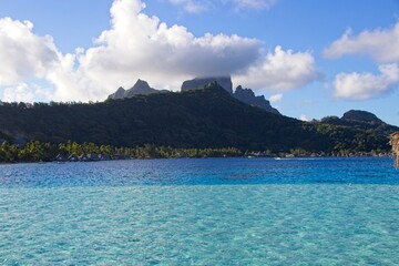 Wall Mural - The extinct volcano of Bora Bora rises above its crystal clear lagoon