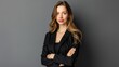 © Johannes - Happy youthful confident professional business woman, pretty trendy female executive looking at camera, standing arms crossed on gray background