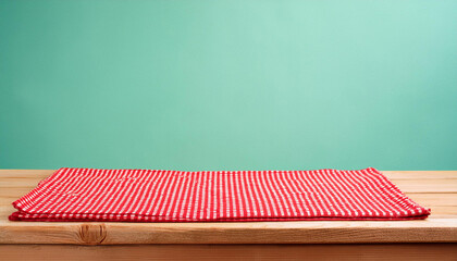 Wall Mural - Empty wooden deck table and red checked tablecloth over mint wallpaper background