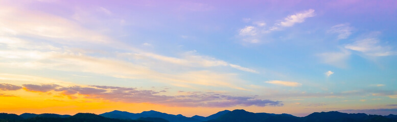 Wall Mural - Sunset Sky over the mountain as Twilight in the Evening as the colors of Sunset Horizon scene