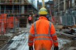 © Boraryn - Construction worker in high visibility uniform walking on a construction site
