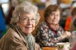 © Татьяна Евдокимова - Portrait of a cheerful retired woman with glasses participating in a group hobby event, smiling warmly at the camera indoors
