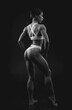 © andy_gin - Black and white image of a sports woman in the studio. Beautiful body.