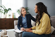 © peopleimages.com - Woman, therapy and notes in office for mental health, talking with empathy or encouragement. Female therapist, patient and consulting room with discussion for stress and anxiety, support and help