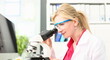 © H_Ko - Laboratory Doctor Analyzing Microscope Research. Woman Scientist in Protective Glasses Working on Pharmaceutical Experiment in Lab. Medical Scientific Technology. Chemist Working on Analysis