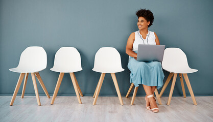 Poster - Woman, waiting room with laptop and wall background, interview or smile for appointment. Hiring, career opportunity or recruitment in modern office workplace, computer and Human resource candidate