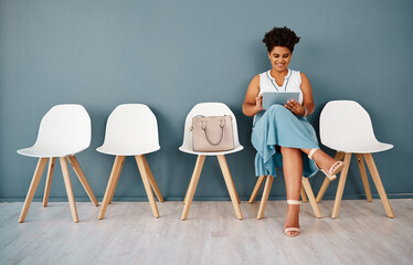 Canvas Print - Chairs, woman in waiting room and wall background, smile and tablet for appointment. Hiring, opportunity and recruitment in modern office workplace for interview, person and human resource candidate