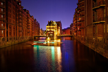 Wall Mural - Water castle in Speicherstadt, Hamburg, Germany, seen from Poggenmuhlen Bridge.