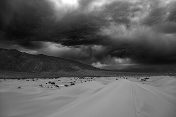 Wall Mural - Cloudy sky before the rain at Mesquite Sand Dunes in Death Valley National Park