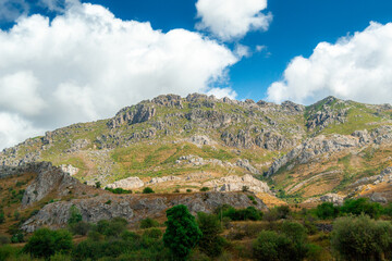 Wall Mural - Scenic view of Asturias, Spain's rocky mountains on a cloudy day with vibrant colors