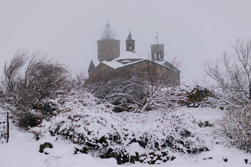 Wall Mural - Scenic view of an Armenian curch covered in snow.